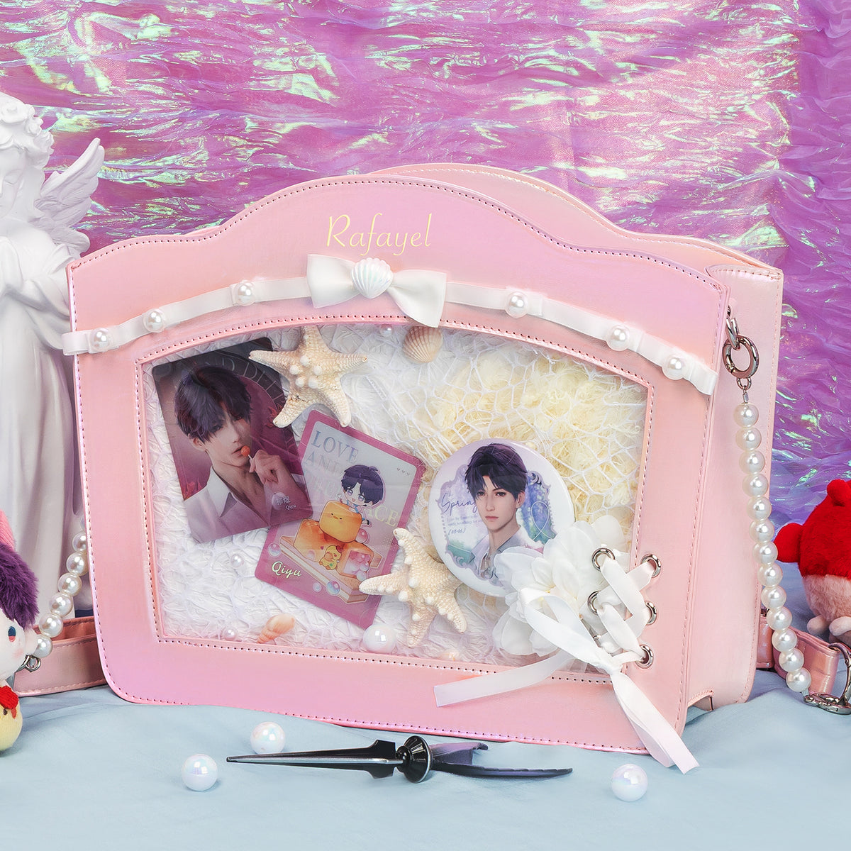 Pink shell-shaped ita bag decorated with anime photocards, charms and accessories