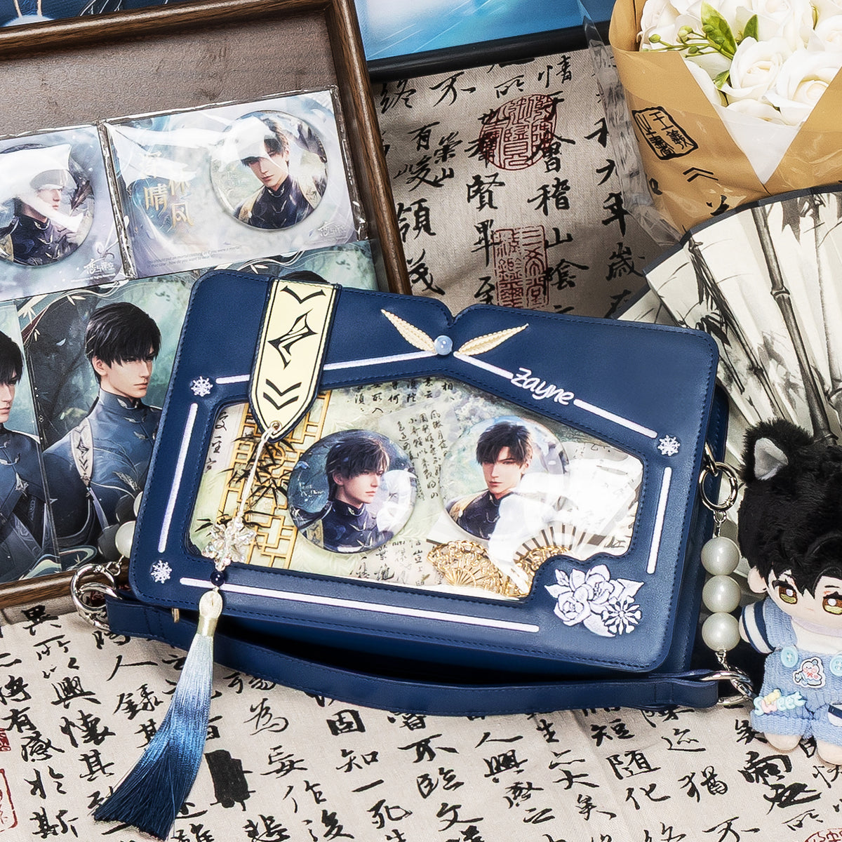 Moli Ita Bag displayed with blue character photocards, badges and plush accessories